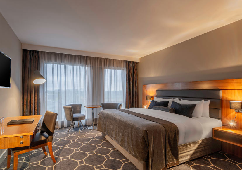 King size bed at Athlone Springs Hotel.